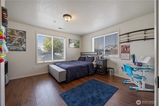 a bedroom with furniture and a window