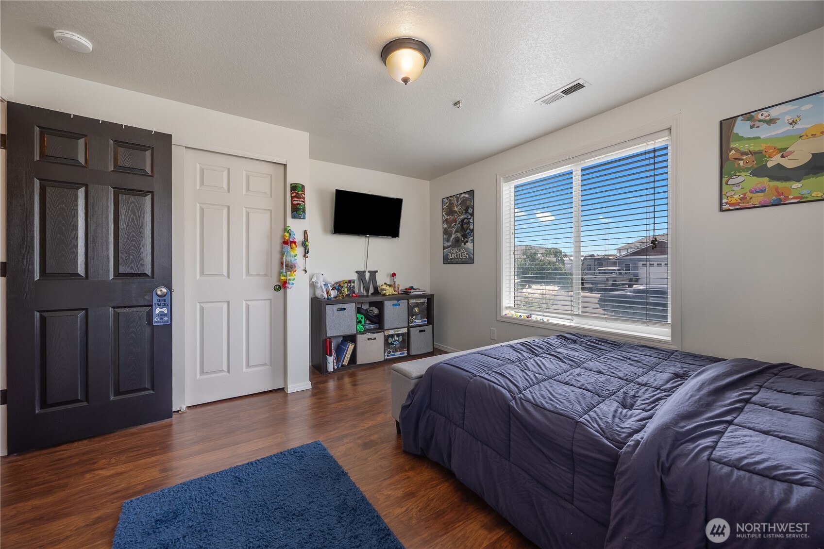 5421 Jackson Lane Pasco, WA 99301 - Photo 12 of 40 a bedroom with a bed window and a flat screen tv