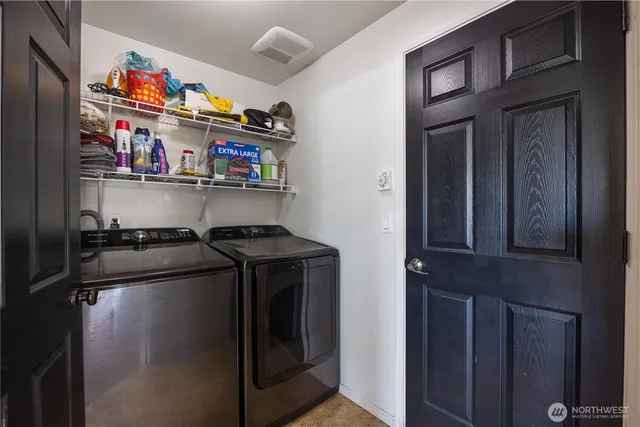 a kitchen with stainless steel appliances granite countertop a refrigerator and a stove