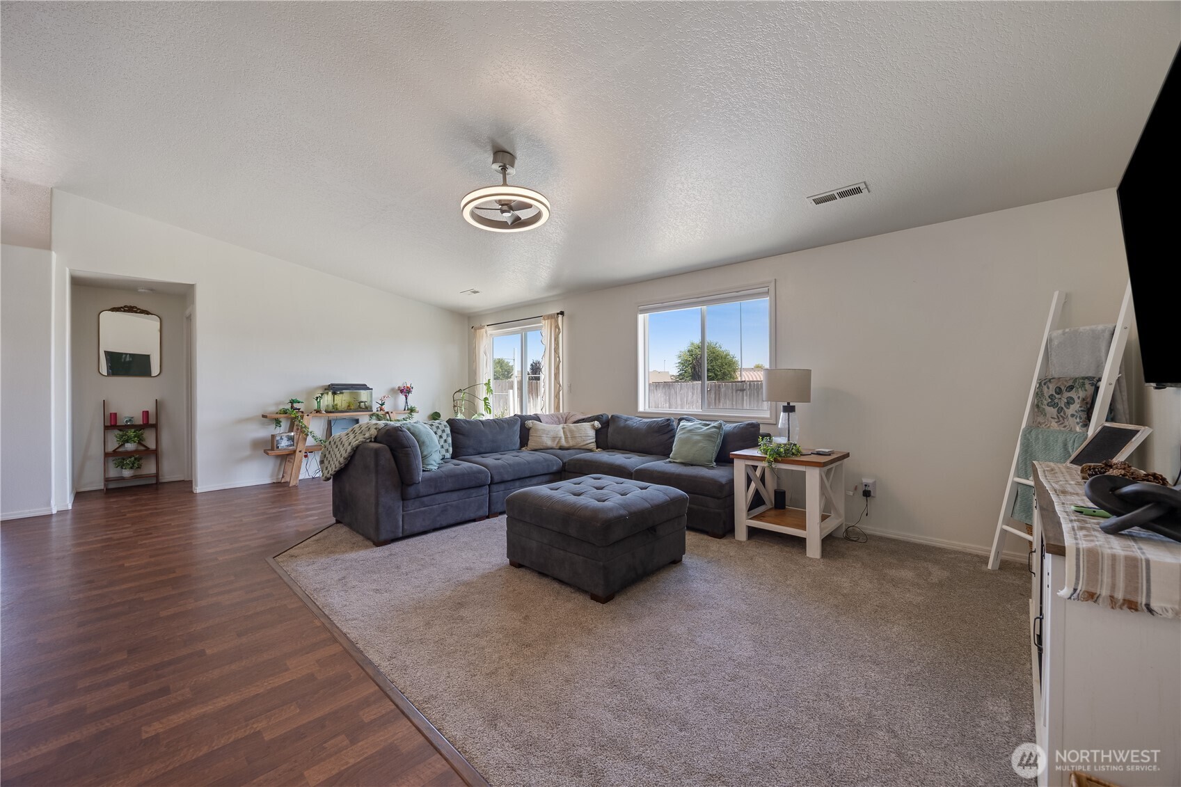 5421 Jackson Lane Pasco, WA 99301 - Photo 23 of 40 a living room with furniture and a flat screen tv