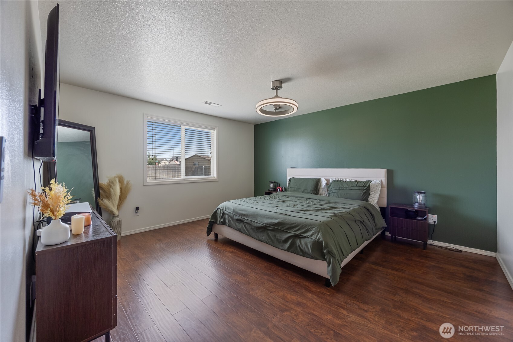 5421 Jackson Lane Pasco, WA 99301 - Photo 27 of 40 a bedroom with a bed and wooden floor