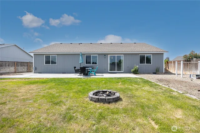 a view of house with swimming pool outdoor seating