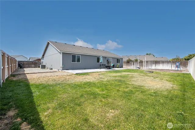 a house view with swimming pool and garden