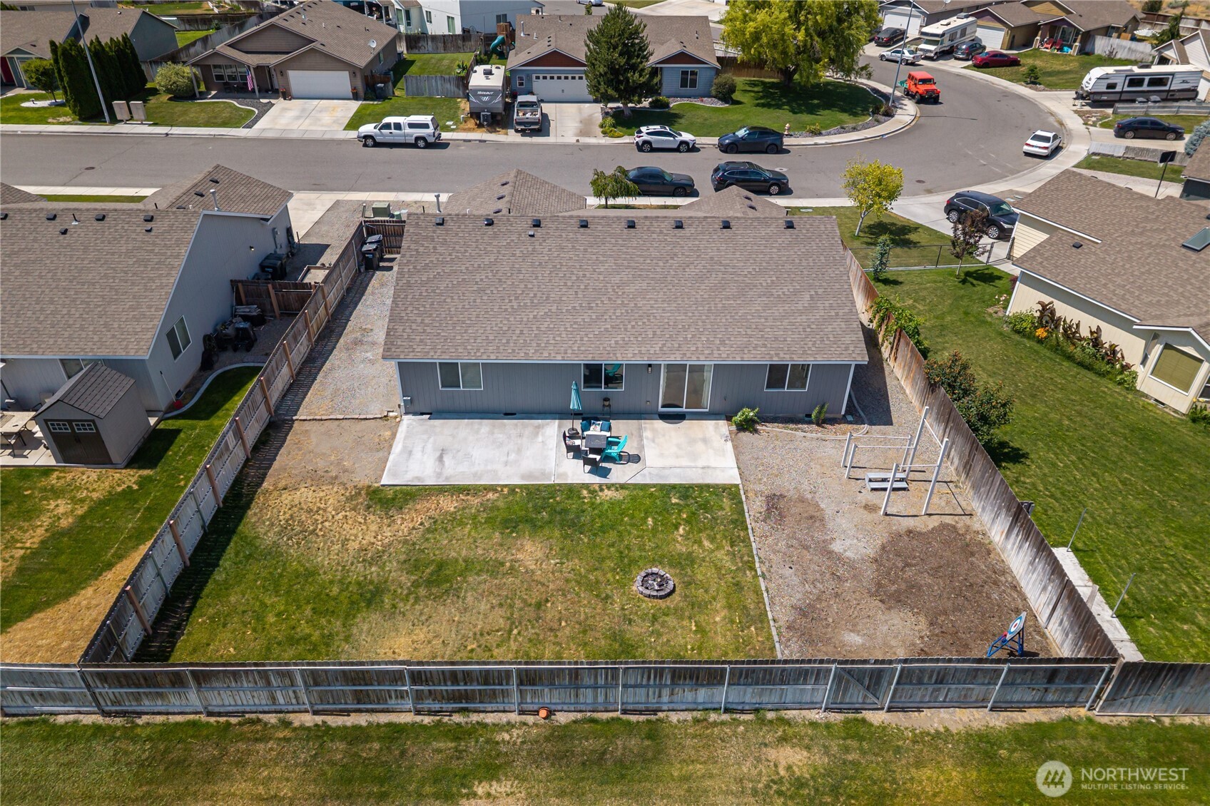 5421 Jackson Lane Pasco, WA 99301 - Photo 38 of 40 an aerial view of a house with swimming pool and tennis court