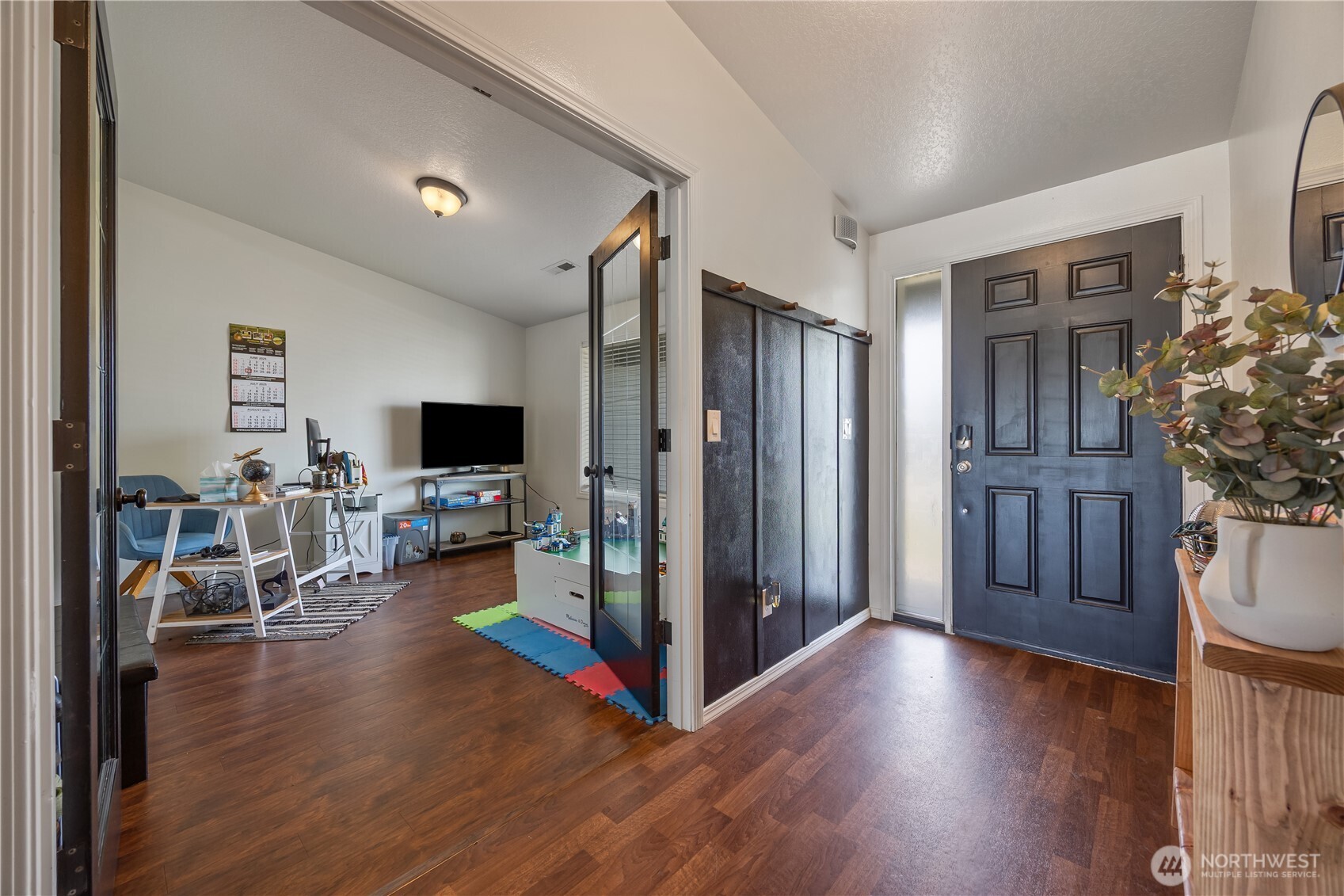 5421 Jackson Lane Pasco, WA 99301 - Photo 6 of 40 a living room with furniture and a flat screen tv