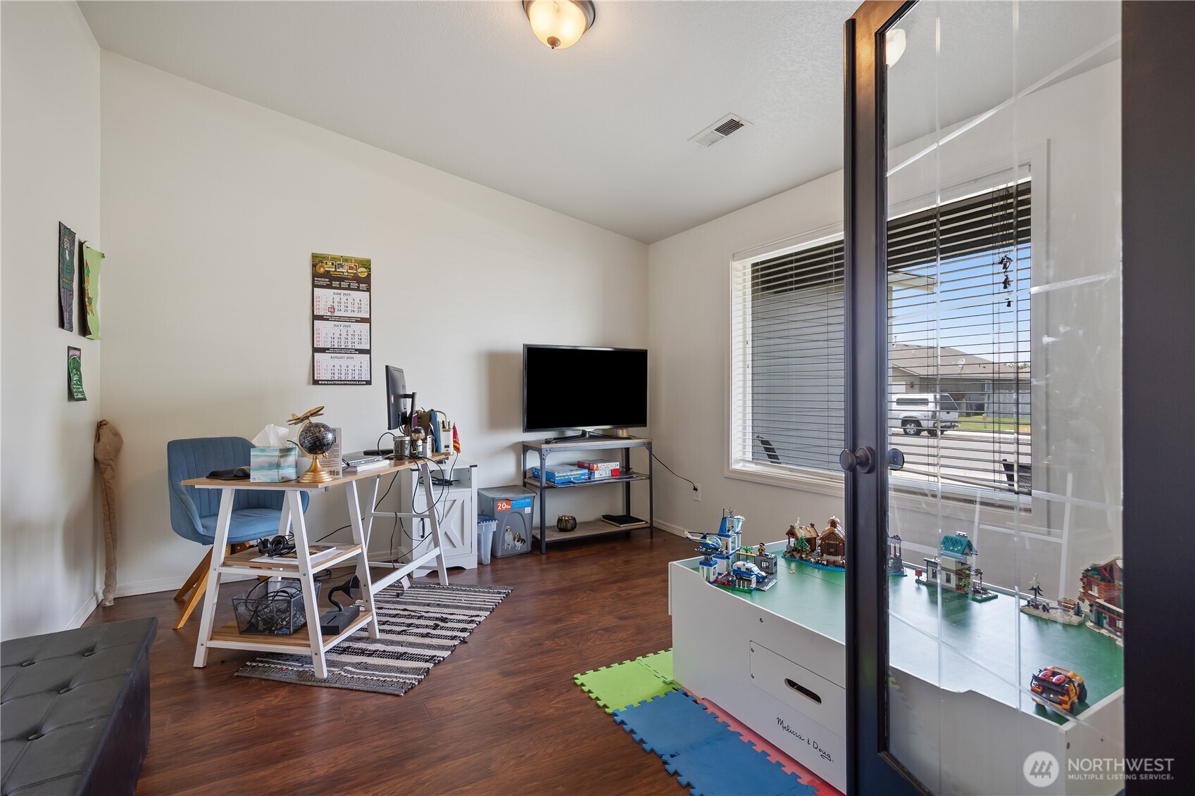 5421 Jackson Lane Pasco, WA 99301 - Photo 7 of 40 a living room with furniture and a flat screen tv