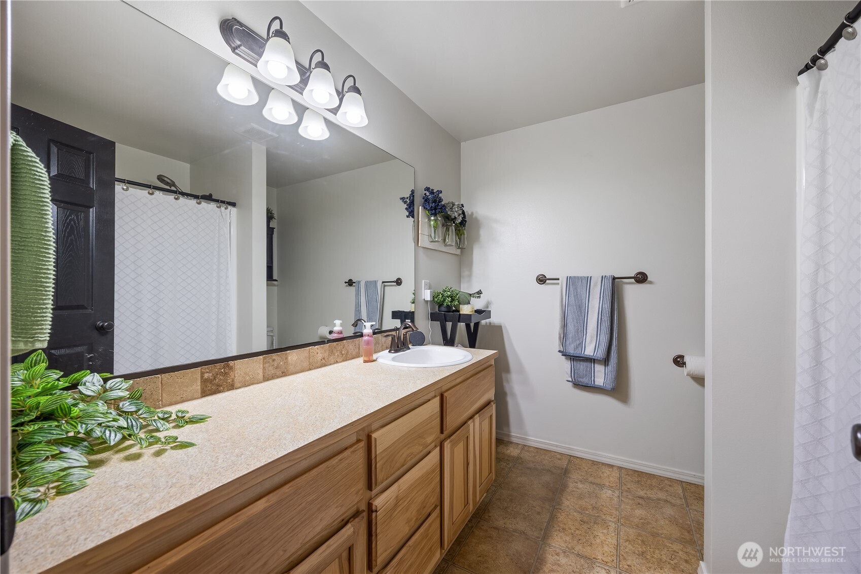5421 Jackson Lane Pasco, WA 99301 - Photo 10 of 40 a bathroom with a sink vanity granite and a mirror