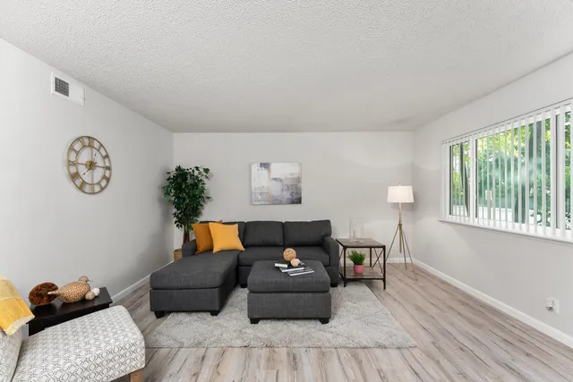 a living room with furniture and a window