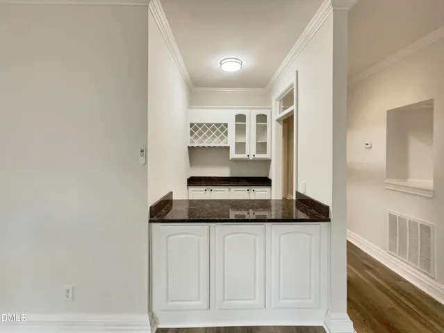 a kitchen with a stove and cabinets