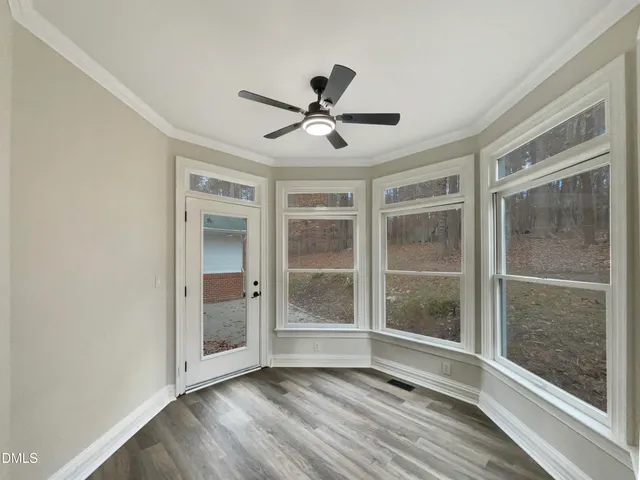 a view of room with window and hardwood floor