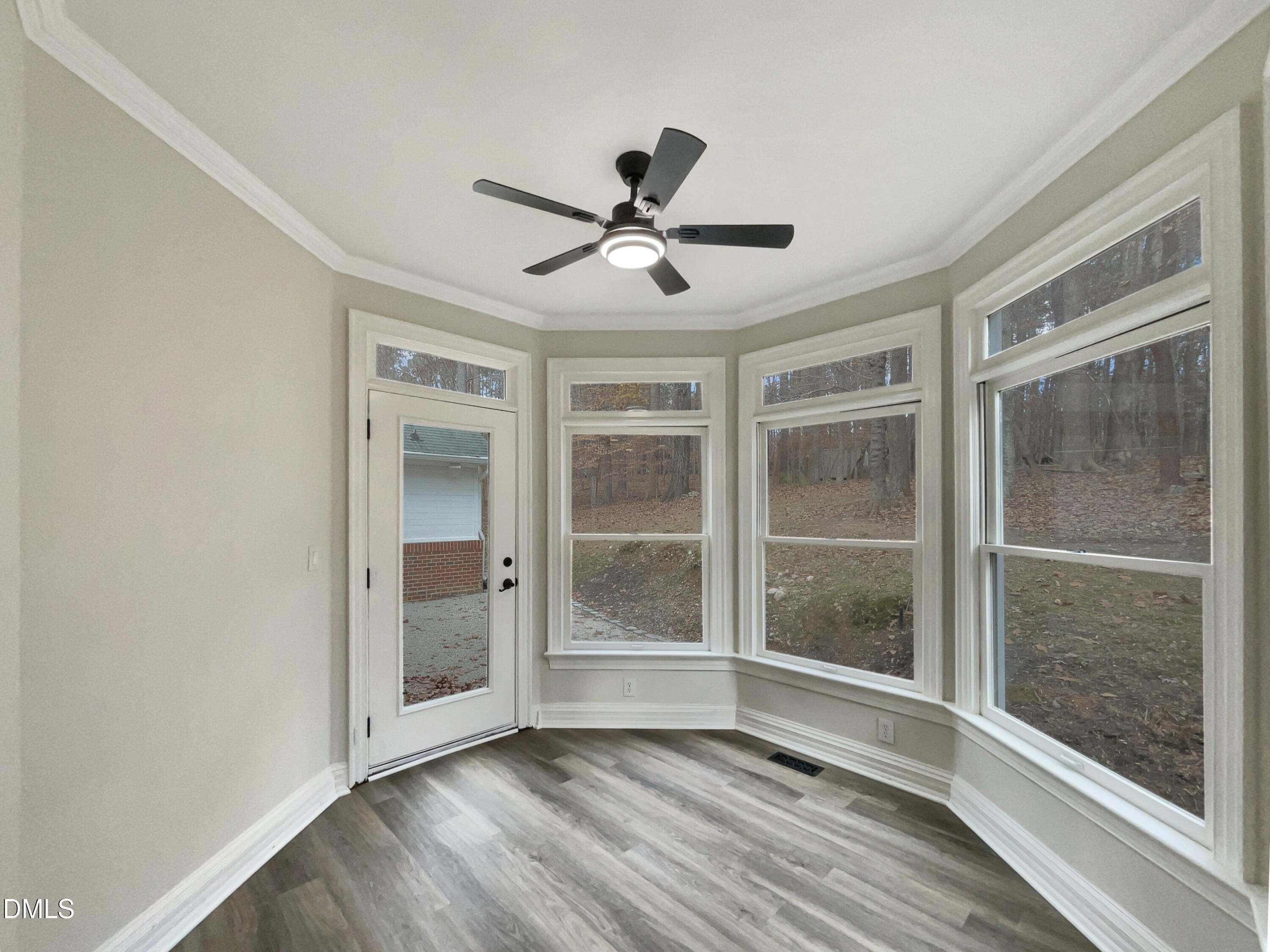 6212 Trevor Court Raleigh, NC 27613 - Photo 13 of 24 a view of room with window and hardwood floor