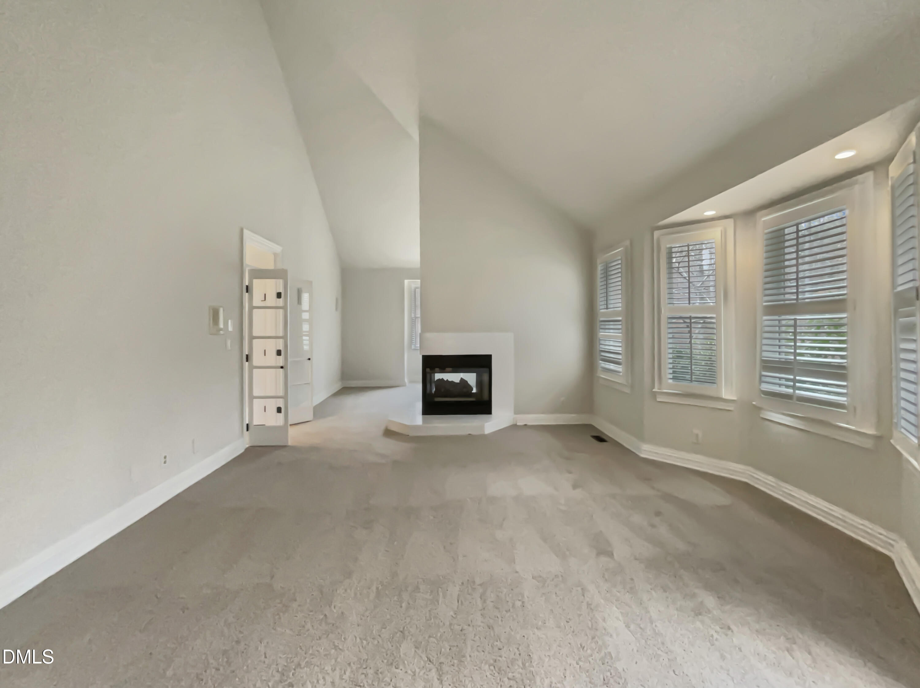 6212 Trevor Court Raleigh, NC 27613 - Photo 16 of 24 a view of empty room with a fireplace