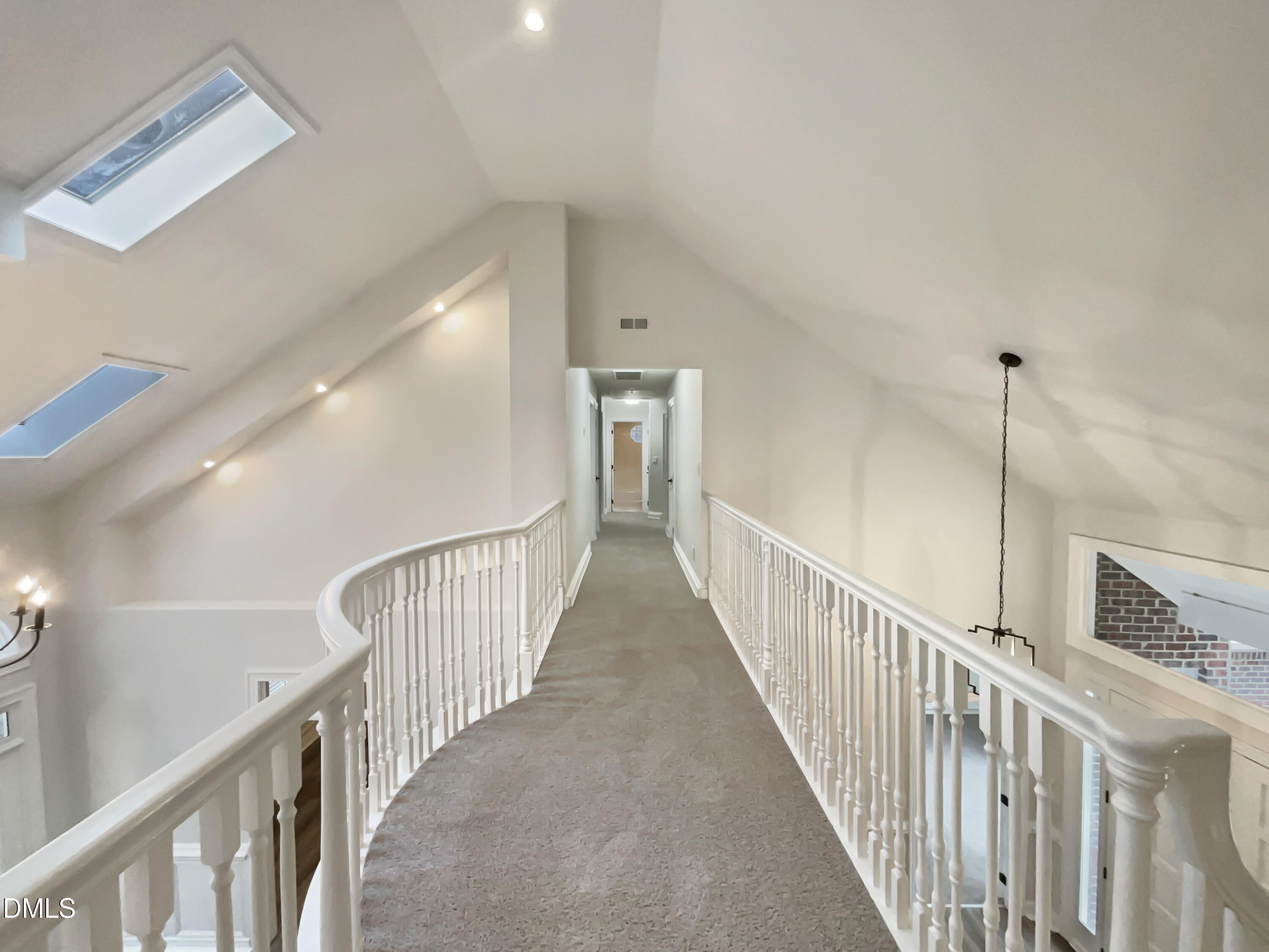 6212 Trevor Court Raleigh, NC 27613 - Photo 18 of 24 a view of staircase with railing and a rug