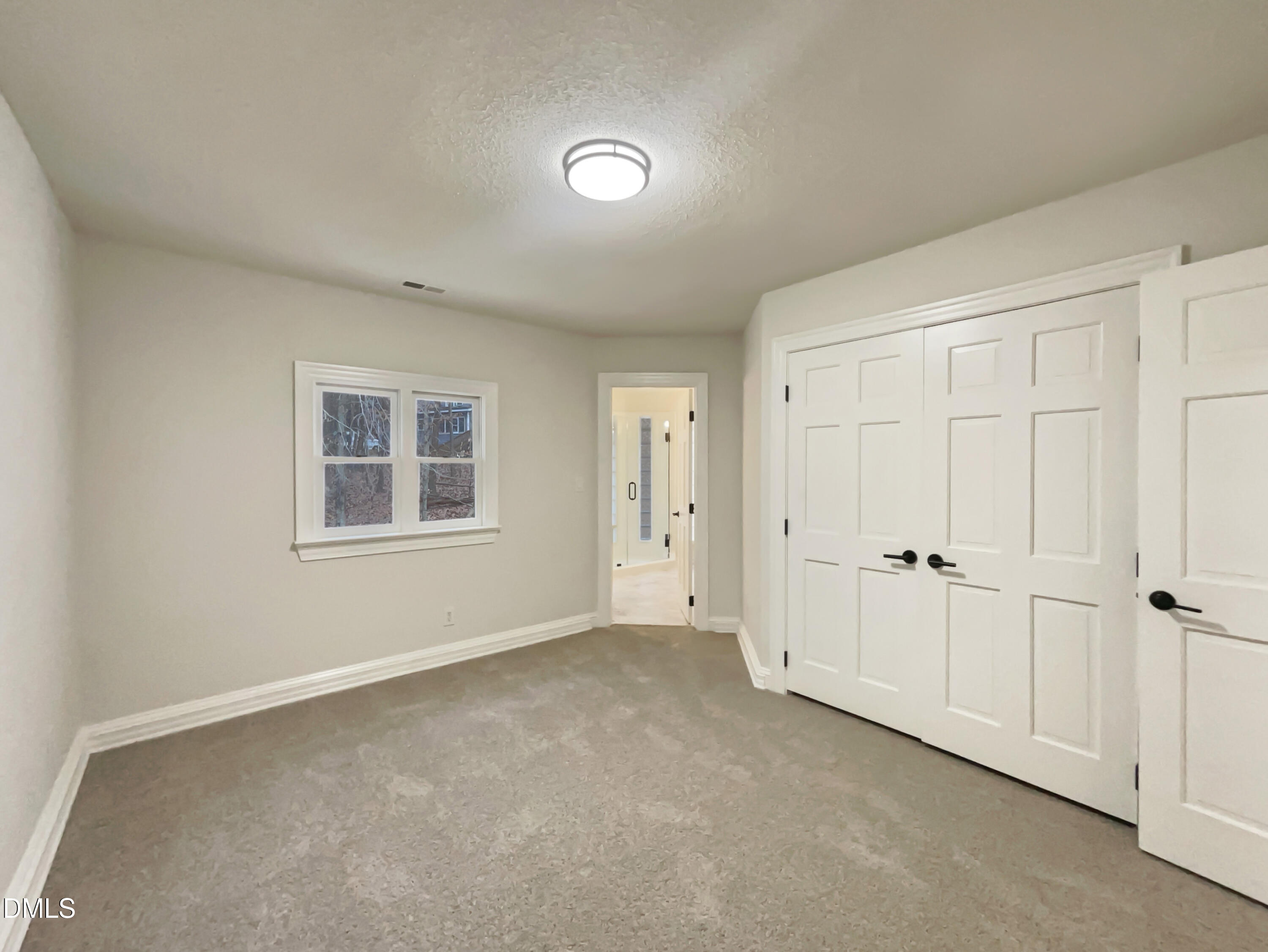 6212 Trevor Court Raleigh, NC 27613 - Photo 19 of 24 a view of an empty room with a window