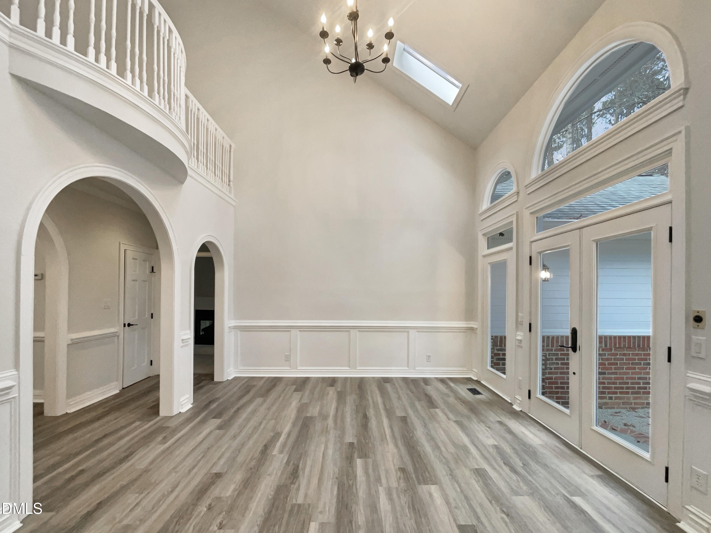 6212 Trevor Court Raleigh, NC 27613 - Photo 9 of 24 a view of a hallway view with wooden floor and staircase