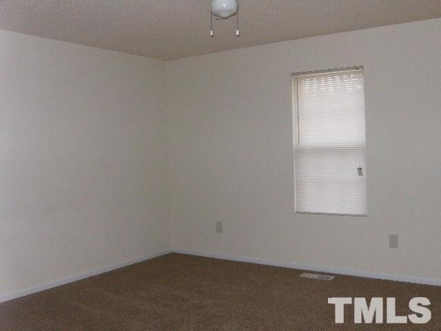 508 Hunter Way Clayton, NC 27520 - Photo 2 of 7 an empty room with a window