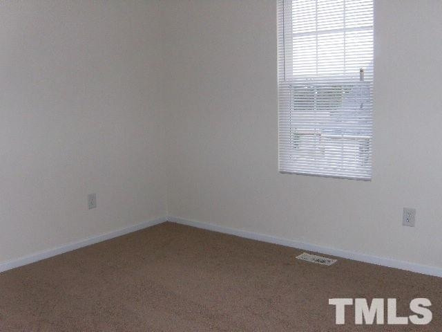 508 Hunter Way Clayton, NC 27520 - Photo 3 of 7 an empty room with a window