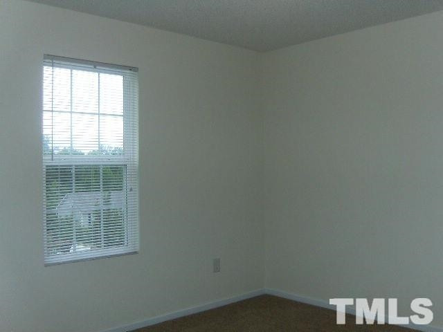508 Hunter Way Clayton, NC 27520 - Photo 4 of 7 an empty room with a window