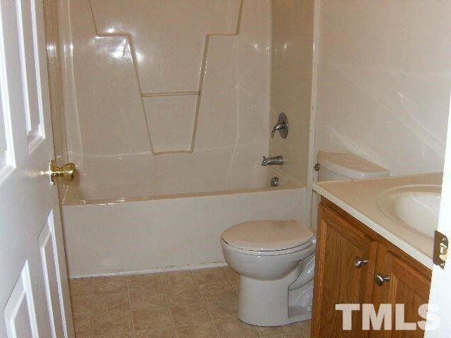 508 Hunter Way Clayton, NC 27520 - Photo 6 of 7 a bathroom with a shower and toilet