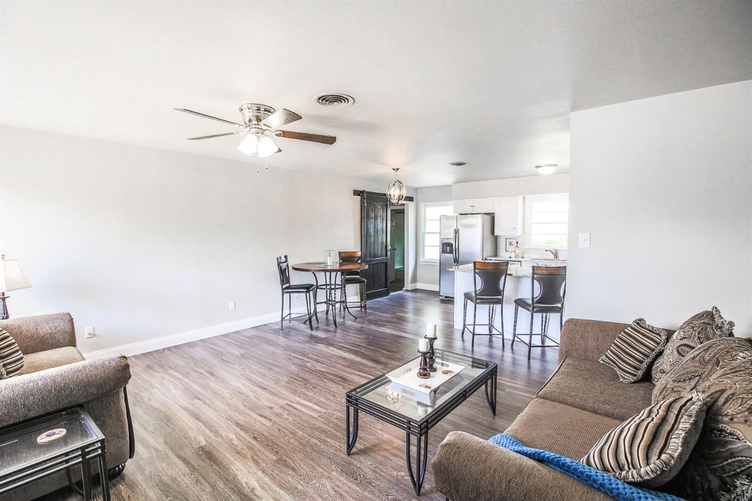 5002 43rd Street Lubbock, TX 79414 - Photo 7 of 10 a living room with furniture a ceiling fan and a rug
