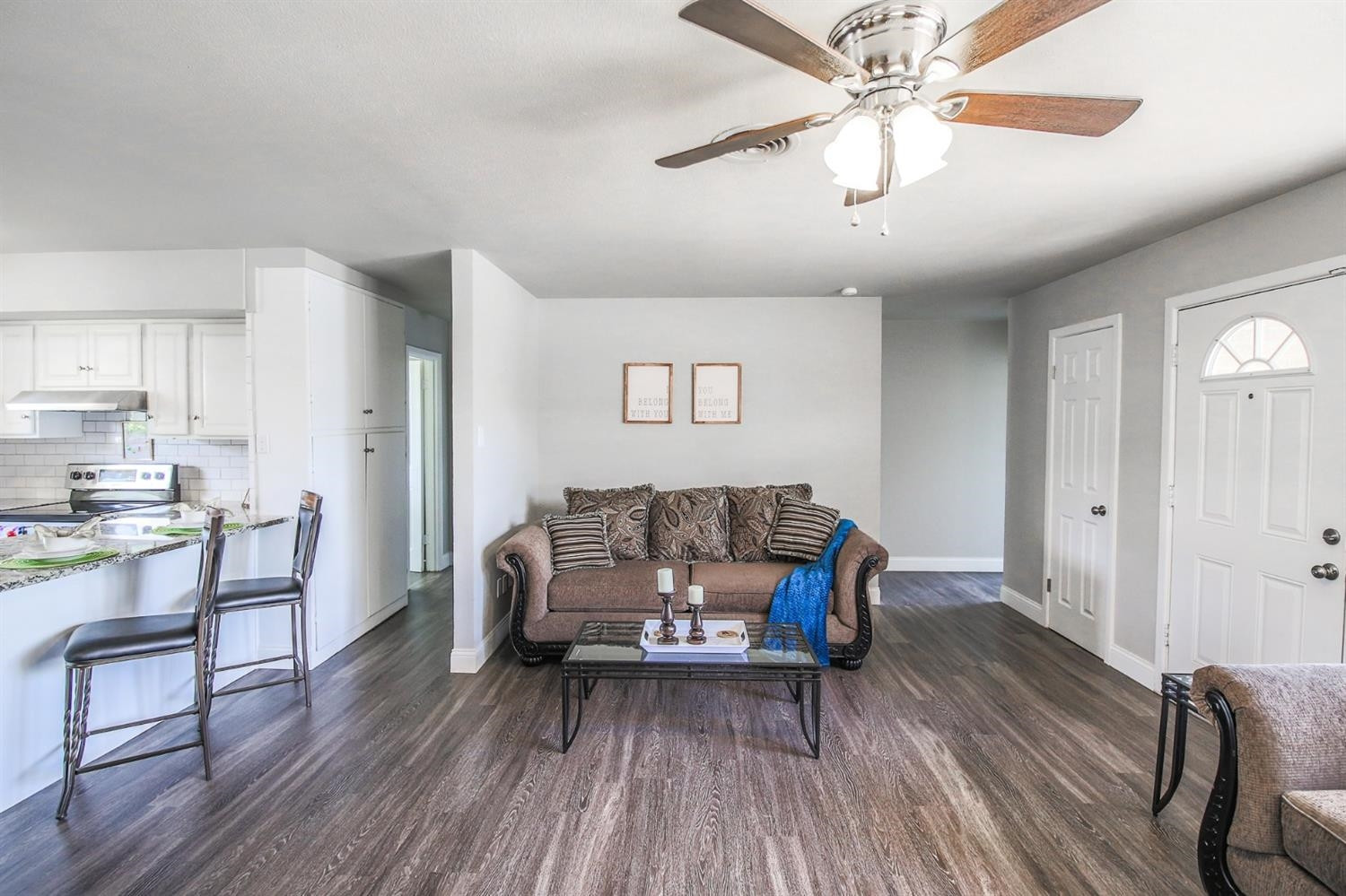 5002 43rd Street Lubbock, TX 79414 - Photo 8 of 10 a living room with furniture and a wooden floor