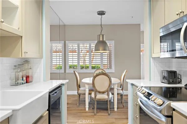 a dining room with furniture and window