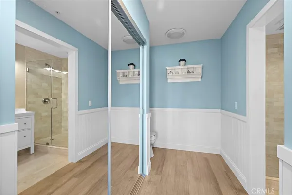 a view of a hallway with bathroom