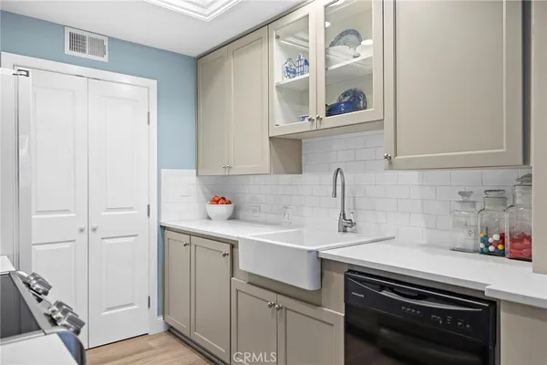 a kitchen with a sink and cabinets