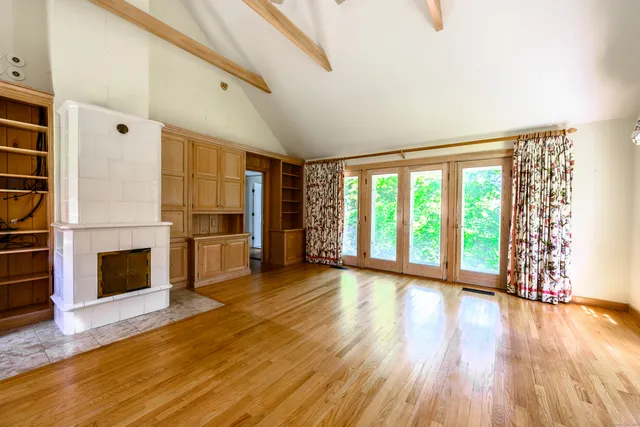 a view of a kitchen with microwave and stove top oven