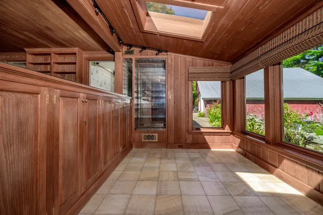 a view of a porch with wooden floor and stairs