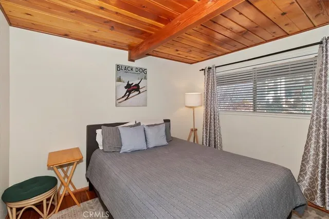 a bedroom with a bed and a chair