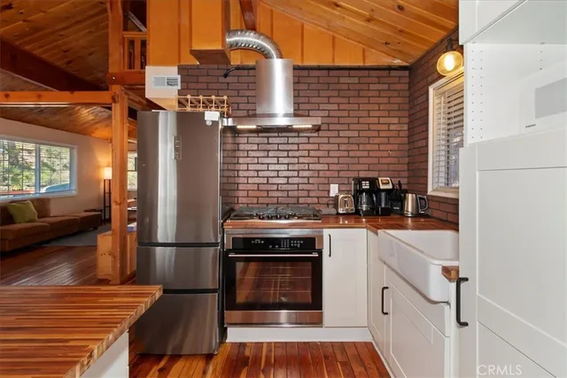 a kitchen with a stove and a refrigerator