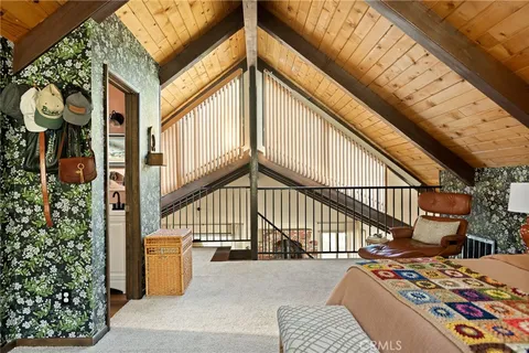 a view of balcony with wooden floor and outdoor seating
