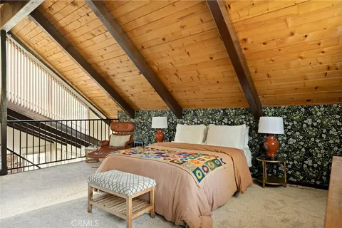 a bedroom with bed and a window