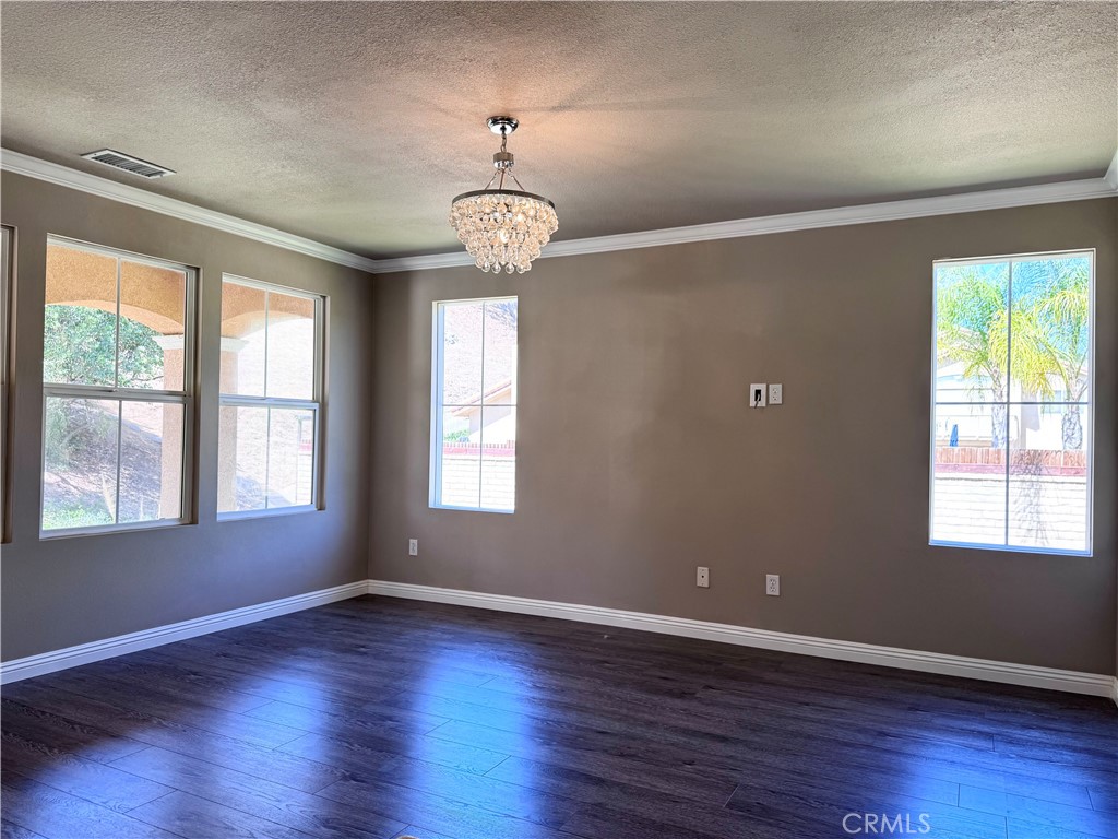 28463 Cascade Road Castaic, CA 91384 - Photo 25 of 29 a view of an empty room with wooden floor and a window