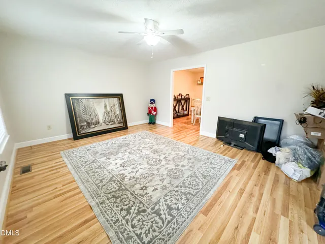 a bedroom with a bed and dresser