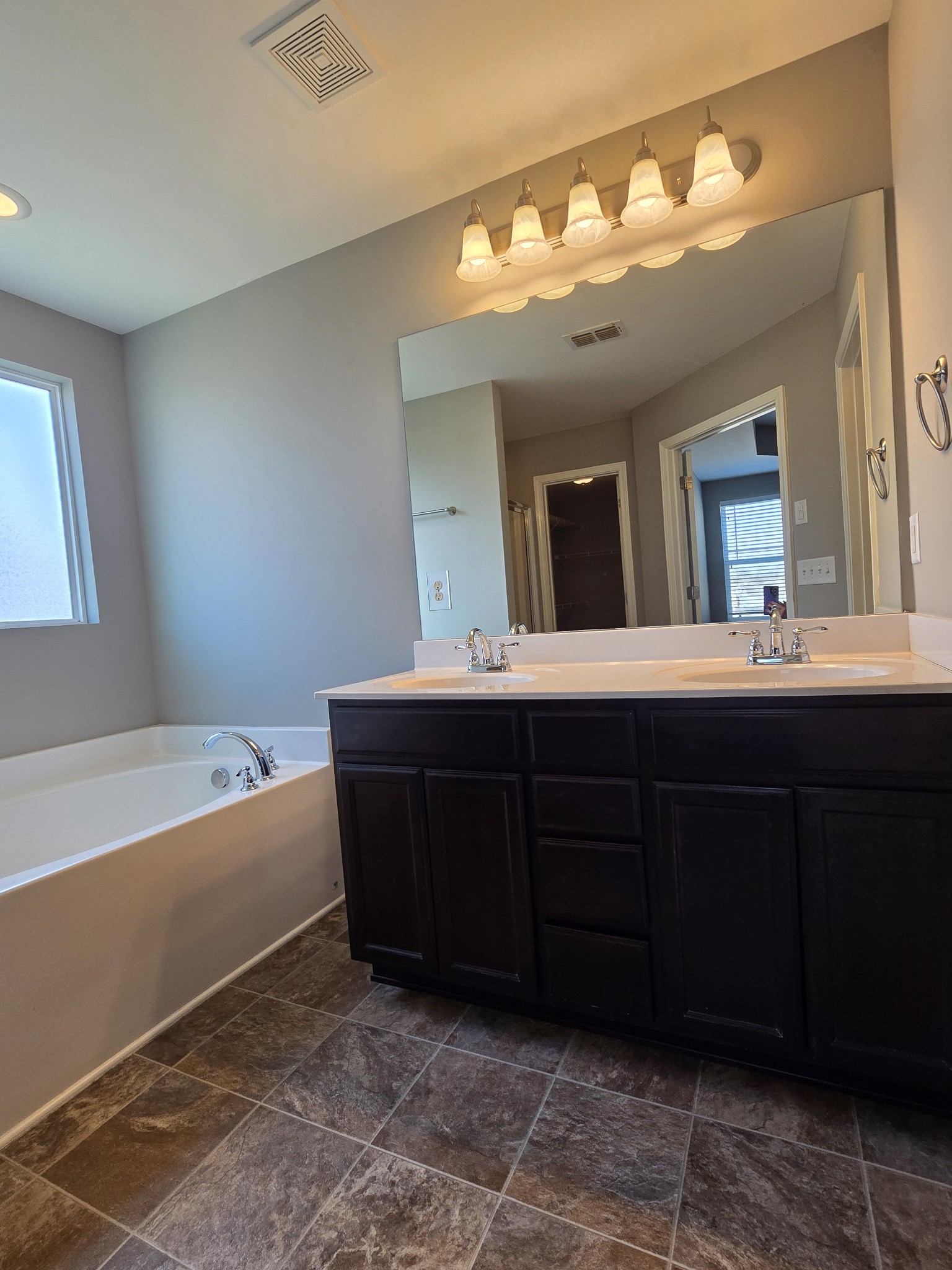 3003 Dove Court Spring Hill, TN 37174 - Photo 16 of 23 a bathroom with a tub sink and mirror