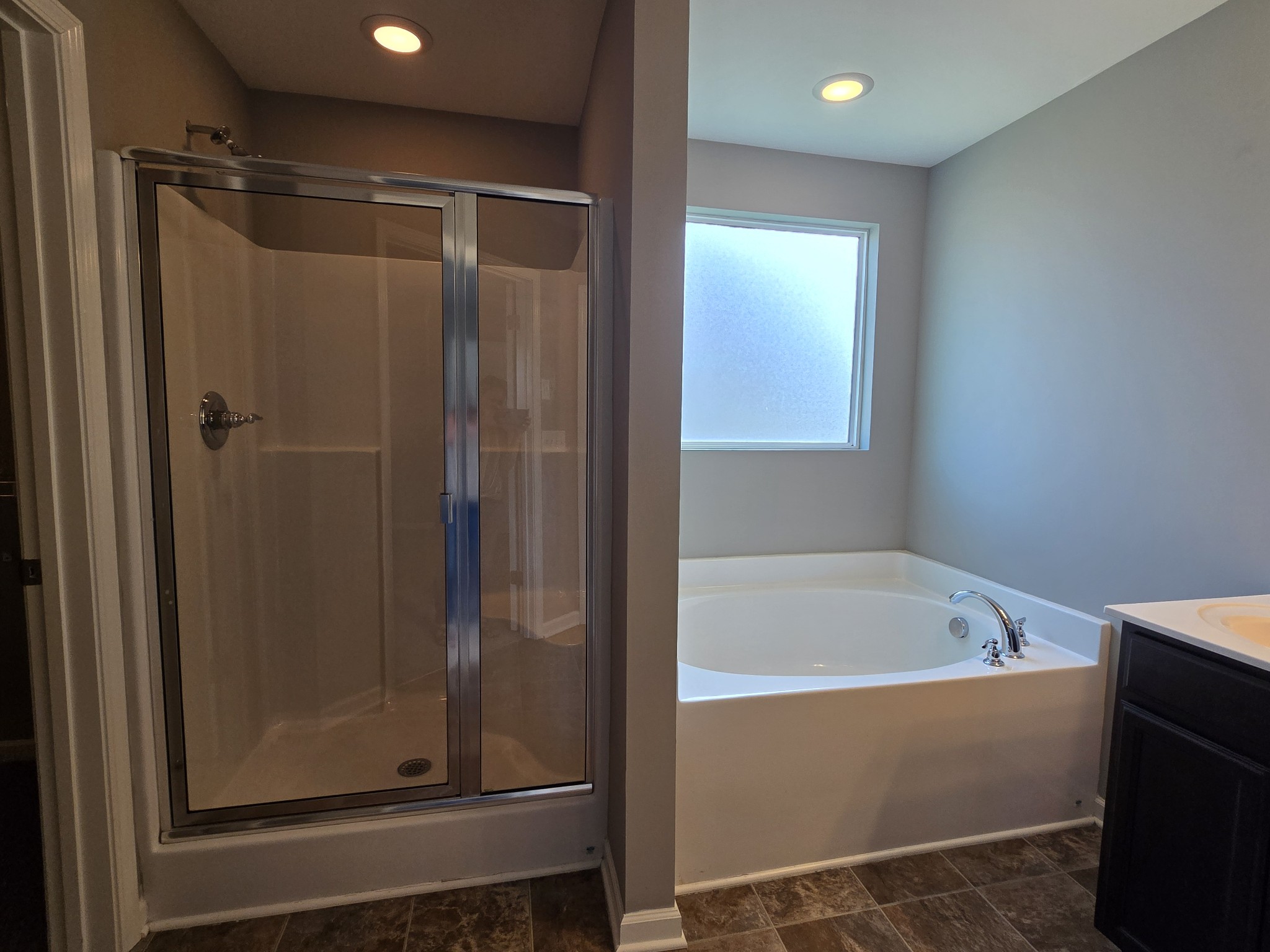 3003 Dove Court Spring Hill, TN 37174 - Photo 17 of 23 a bathroom with a bathtub and a shower