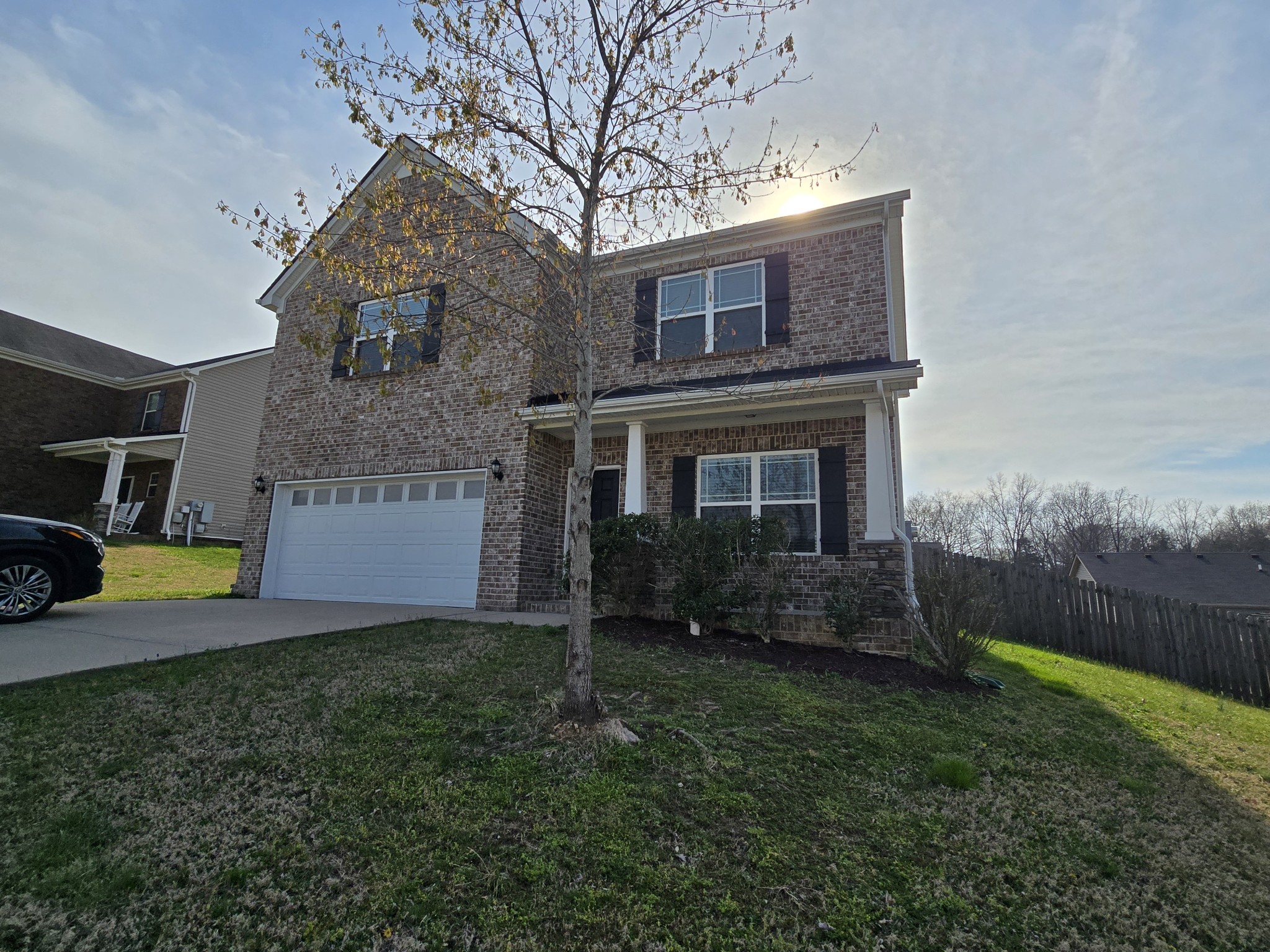 3003 Dove Court Spring Hill, TN 37174 - Photo 2 of 23 a front view of a house with garden