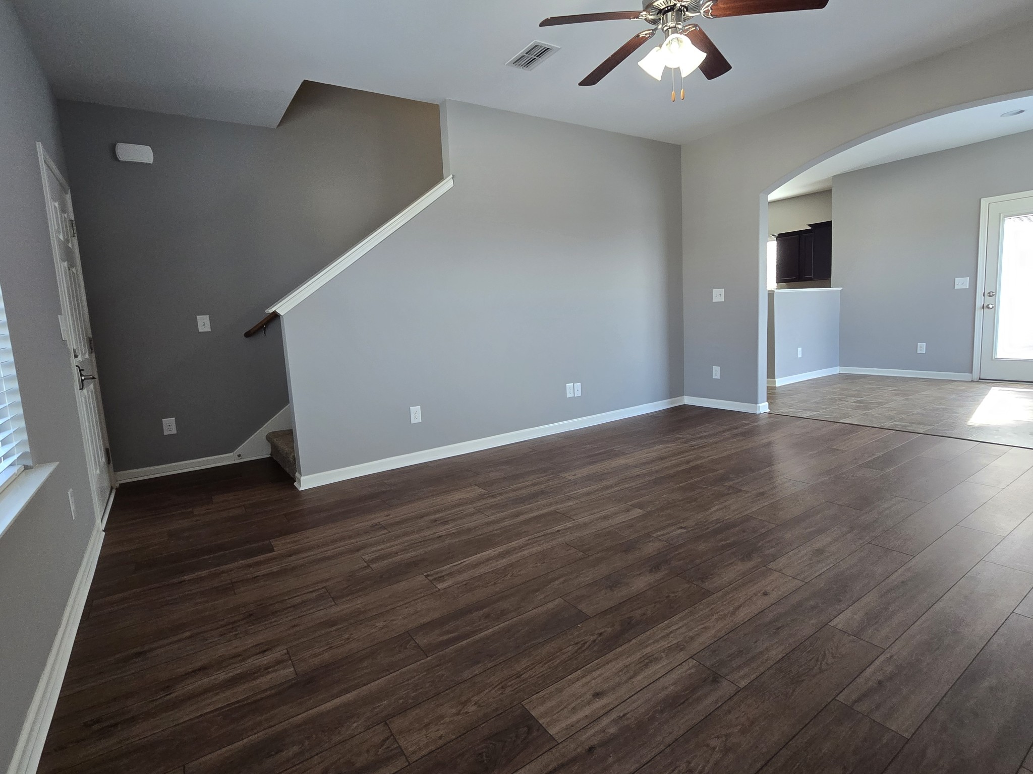3003 Dove Court Spring Hill, TN 37174 - Photo 3 of 23 a view of an empty room with window and wooden floor