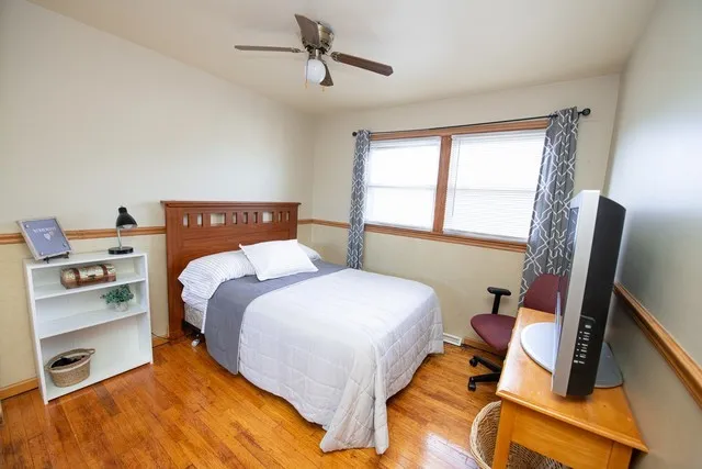 a bed room with a bed and a window