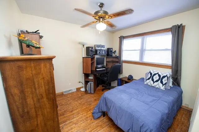 a bedroom with furniture and a window
