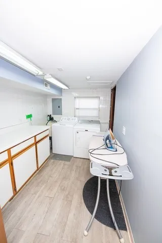 a kitchen with a sink a stove cabinets and a dining table