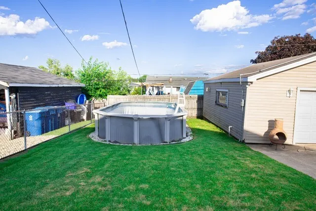 a view of a backyard with plants and a patio