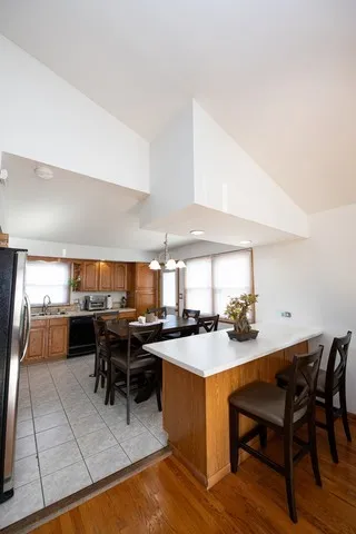 a kitchen with a table chairs and a stove
