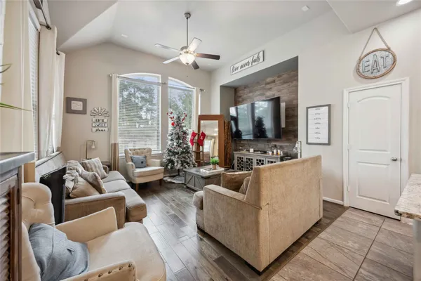 a living room with furniture and a flat screen tv