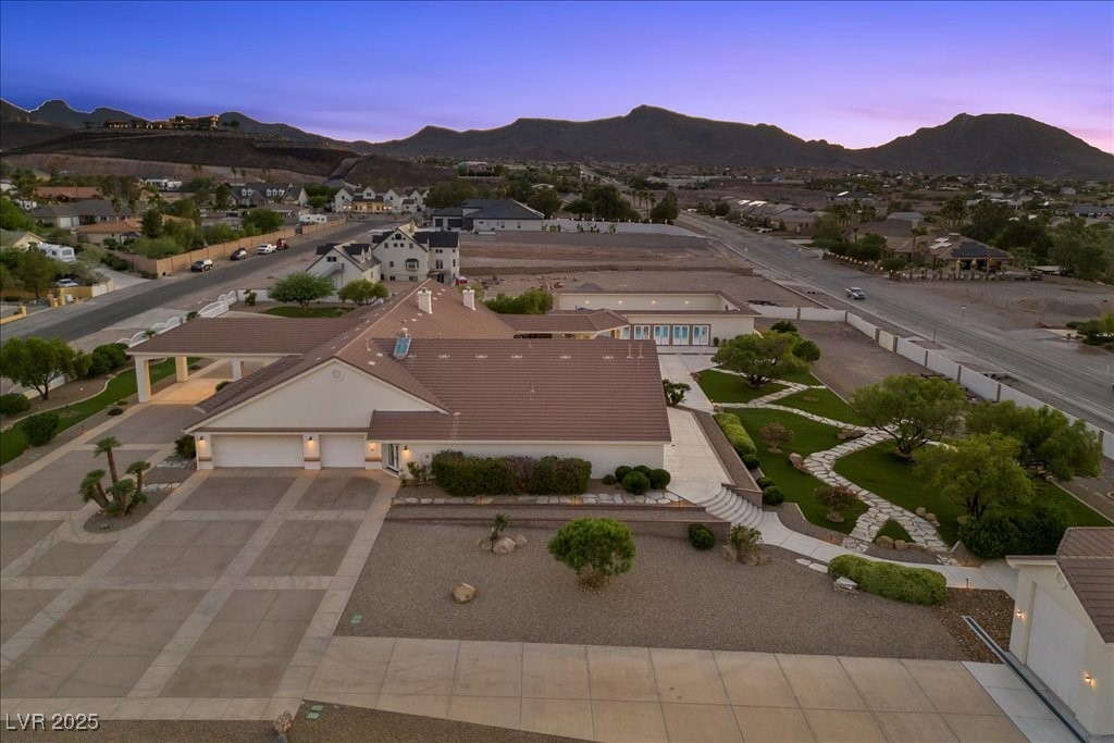 640 Quail Covey Road Henderson, NV 89002 - Photo 70 of 75 Aerial view of property and surrounding area with a mountain backdrop