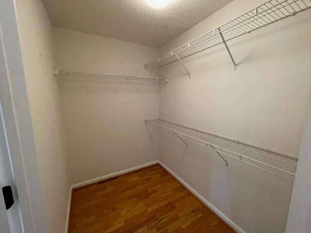 9833 Baywinds Boulevard, Unit 7108 West Palm Beach, FL 33411 - Photo 5 of 10 a view of a room with racks on the wall