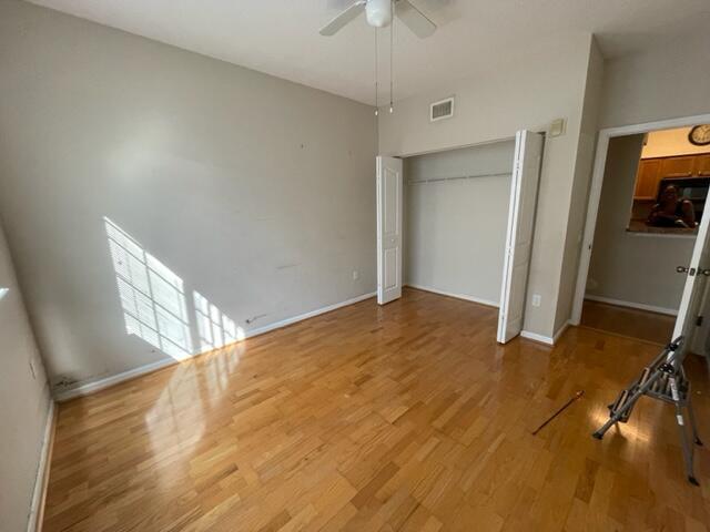 9833 Baywinds Boulevard, Unit 7108 West Palm Beach, FL 33411 - Photo 7 of 10 a view of empty room with wooden floor