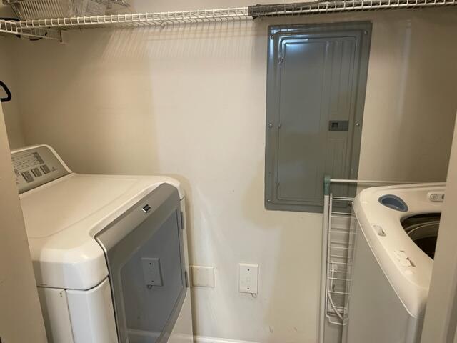 9833 Baywinds Boulevard, Unit 7108 West Palm Beach, FL 33411 - Photo 8 of 10 a utility room with dryer and washer